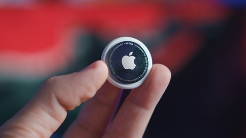 image of persons hand holding an apple air tag - Photo by Onur Binay on Unsplash